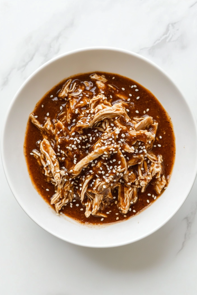 chicken-mole-served-in-a-bowl-with-sesame-seed-garnish