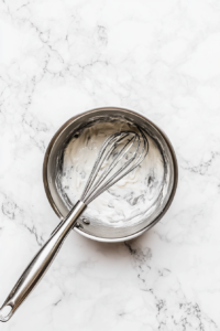 This image shows the pie filling being thickened on the stovetop, forming the smooth and creamy texture for the Vegan Sugar Cream Pie.