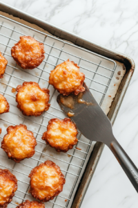 cooling-apple-fritters-on-a-wire-rack