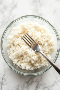 fluffing-cooked-rice-with-a-fork-to-separate-each-grain-with-fork