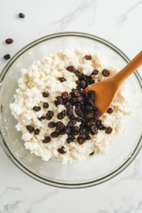 adding-raisins-to-the-mixture-for-traditional-irish-soda-bread