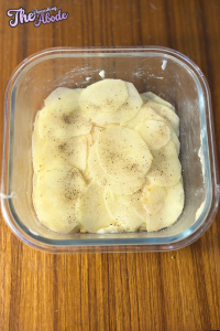 Arrange half of the sliced potatoes