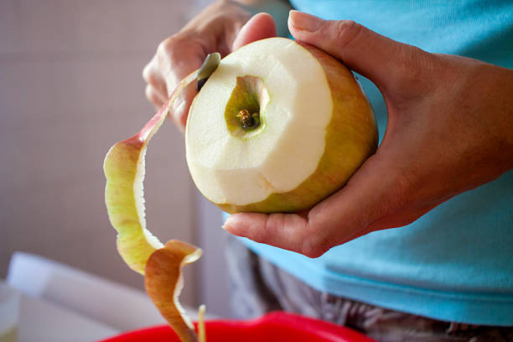 coconut-being-peeled-with-a-sharp-knife-easily-to-save-time-and-effort
