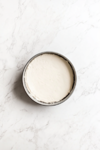 preheating-the-oven-and-lining-baking-sheets-with-parchment-paper-for-cheese-danish-preparation