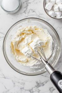 slicing-the-rolled-puff-pastry-into-evenly-sized-squares-for-cheese-danish-preparation