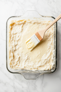 spreading-a-generous-layer-of-herb-butter-over-the-pizza-hut-cheese-sticks-dough
