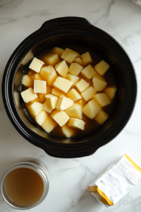 This image shows potatoes being drained, removing any excess broth before mashing to ensure a rich and creamy consistency.