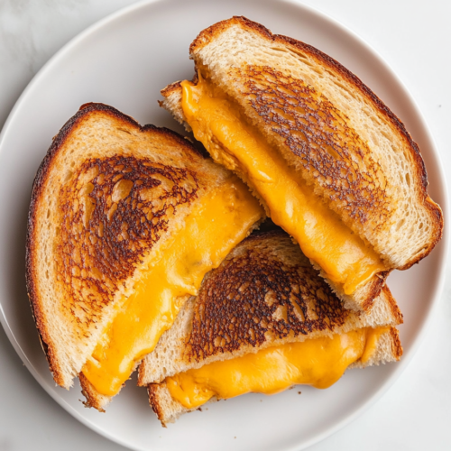 disney-grilled-cheese-sandwich-cut-in-half-with-cheese-dripping