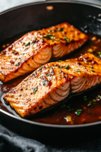 This image shows a flavorful mixture of soy sauce, cooking wine, lemon juice, and black pepper being added to the pan to create a rich hibachi-style glaze.