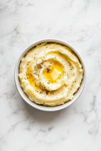 This image shows a bowl of mashed potatoes being kept warm, allowing the flavors to meld before serving.