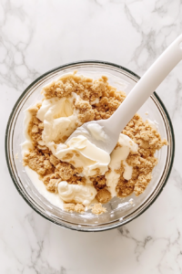 mix-graham-cracker-crumbs-butter-and-sugar