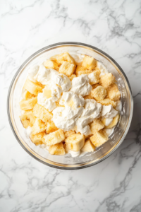 crumbling-moist-pound-cake-and-folding-it-into-whipped-cream-for-a-light-textured-layer