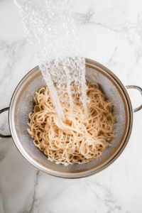 draining-boiled-soba-noodles-using-colander