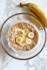 This image shows the wet ingredients being mixed until the batter becomes smooth, thick, and well combined.