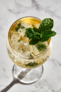 ice-prosecco-soda-poured-into-golden-mint-glass