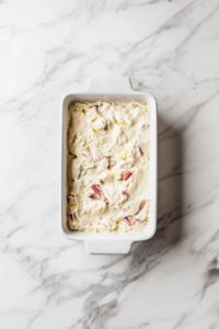 lemon-rhubarb-batter-poured-in-loaf-pan-ready-to-bake