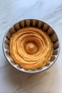 pouring-batter-into-prepared-bundt-pan