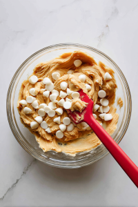 white-chocolate-chips-folded-into-soft-dough-glass-bowl