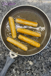 Place the bratwurst sausages in the pan