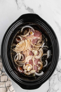 Set the pork on top of the onions