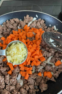 Add the diced carrots and chopped onion