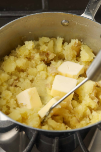Drain the cooked potatoes and place them